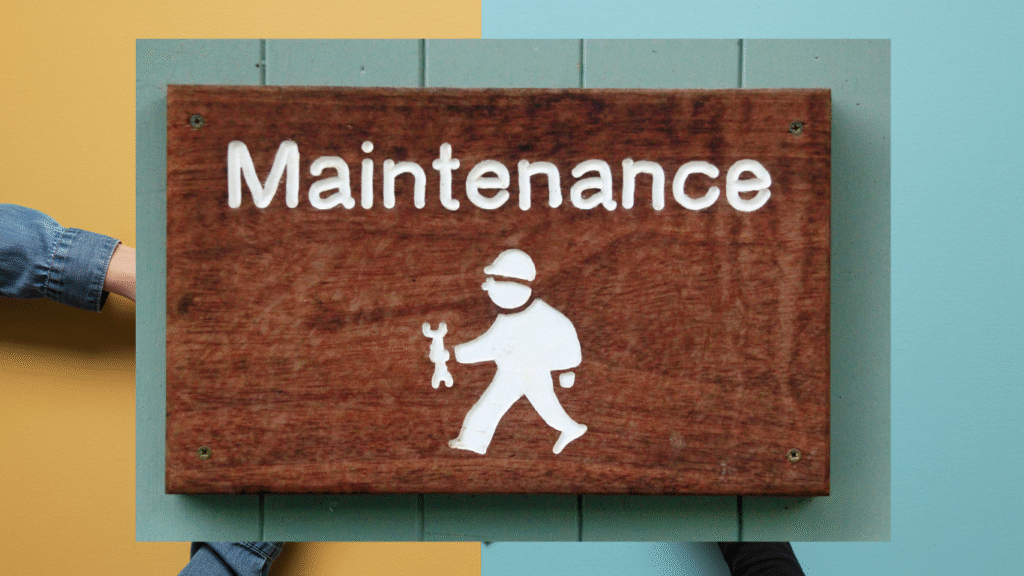 A clear sign reading 'Maintenance' held up against a colorful background, symbolizing the necessity of ongoing updates and care plans for business websites.