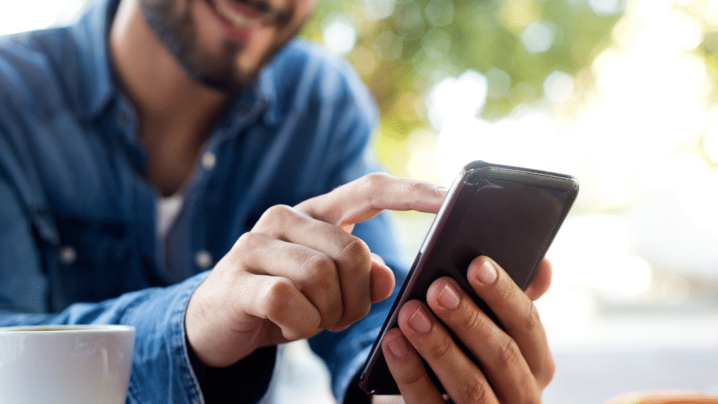 A close-up of a person easily navigating a mobile-first website on a smartphone outdoors, demonstrating a seamless user experience.