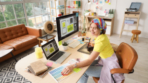 Professional web designer creating a custom website layout using a graphic tablet and color palettes in a modern studio.