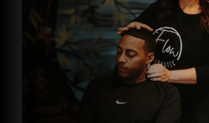 Chiropractor performing a gentle neck adjustment on a patient during a therapeutic chiropractic session.